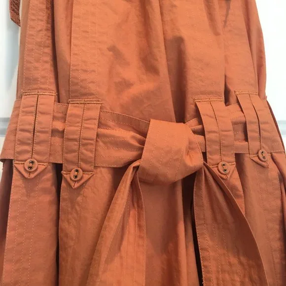 Ulla Johnson orange high neck with ties belted waist 3 layers of ruffles at hem